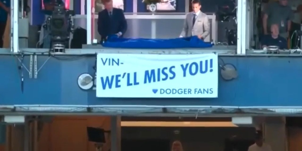 Dodgers and their fans pay tribute to the late Vin Scully with moment of silence and new banner