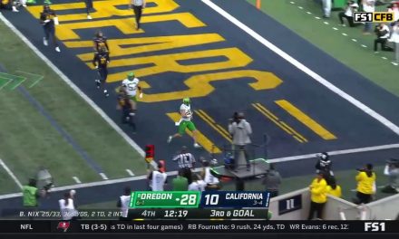 Bo Nix punches in a two-yard rushing touchdown extending the Oregon lead to 35-10