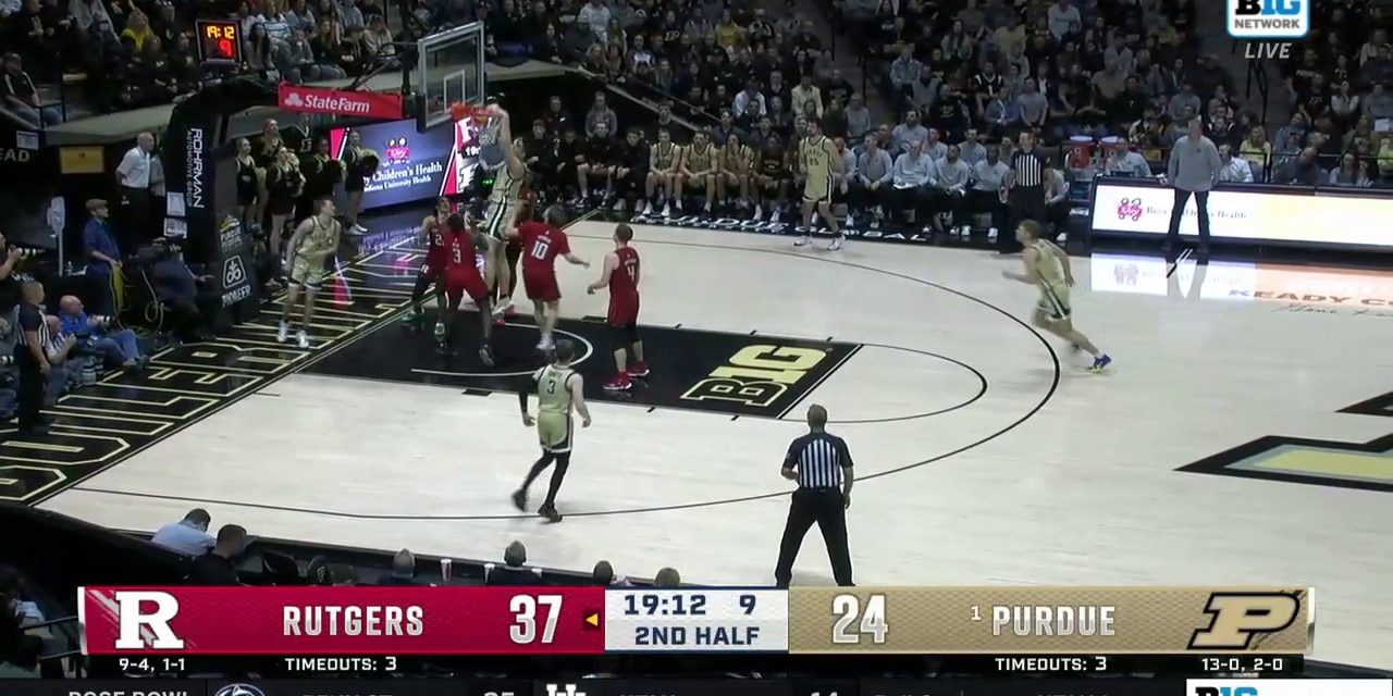 Zach Edey follows the miss with a putback dunk as Purdue tries to chip away at the deficit